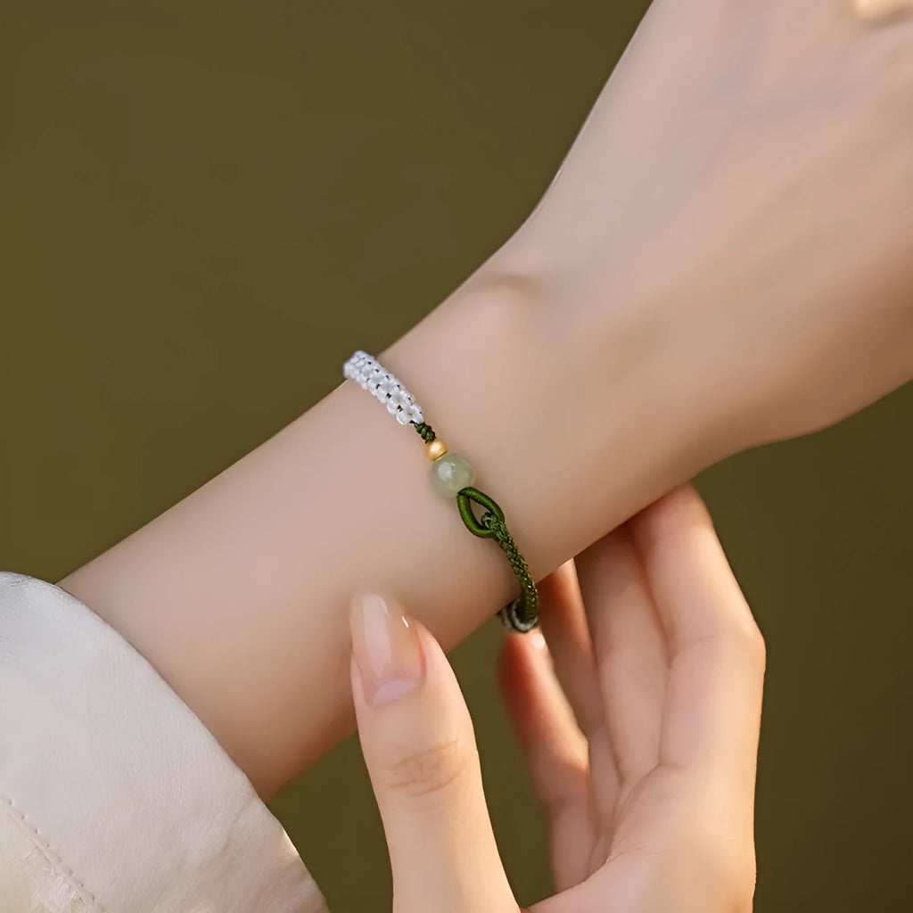 Women's Chinese national bracelet with adjustable cord carrying strap in electroplated finish
