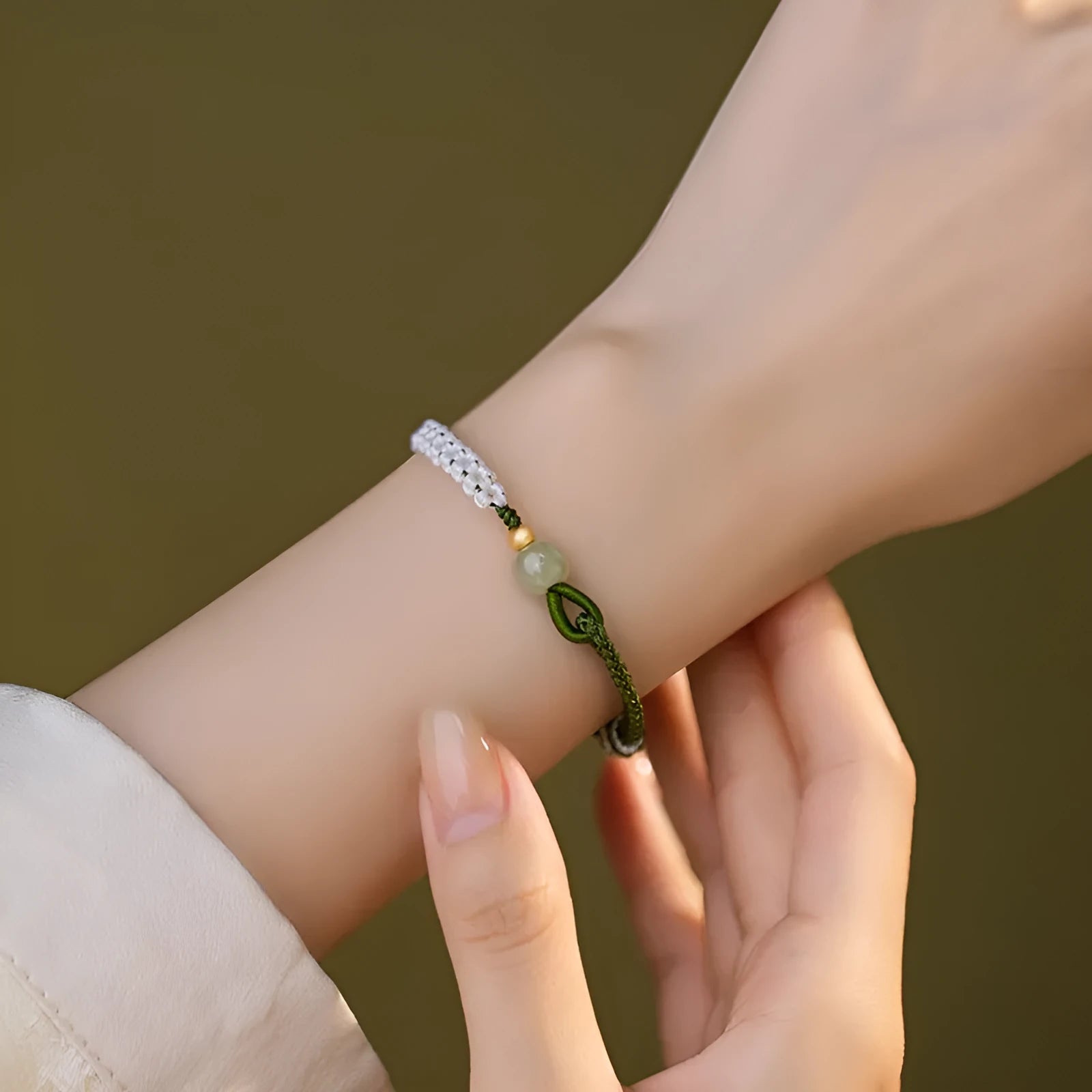 Women's Chinese national bracelet with adjustable cord carrying strap in electroplated finish