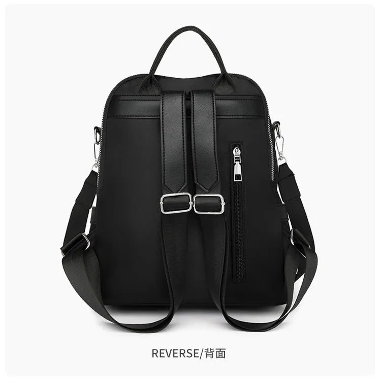 Large capacity soft PU commute backpack in black with three-dimensional pockets and internal mobile phone compartment