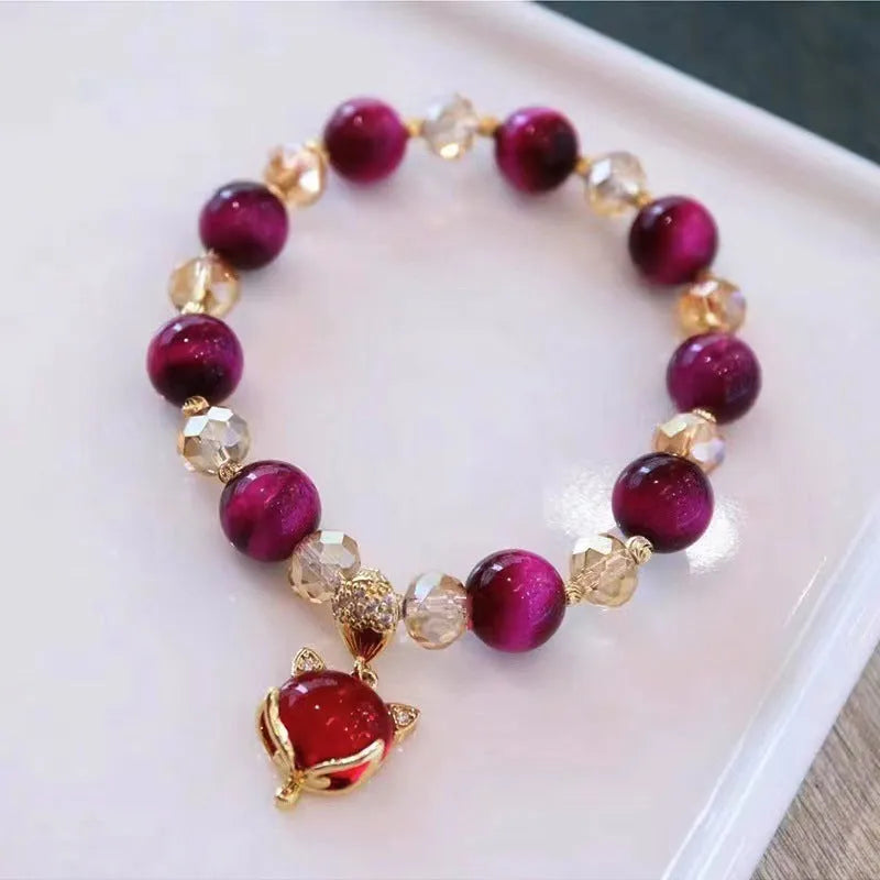 Handmade natural Tigereye stone bracelet with Vanves stone centre, shown in single and double chain designs.