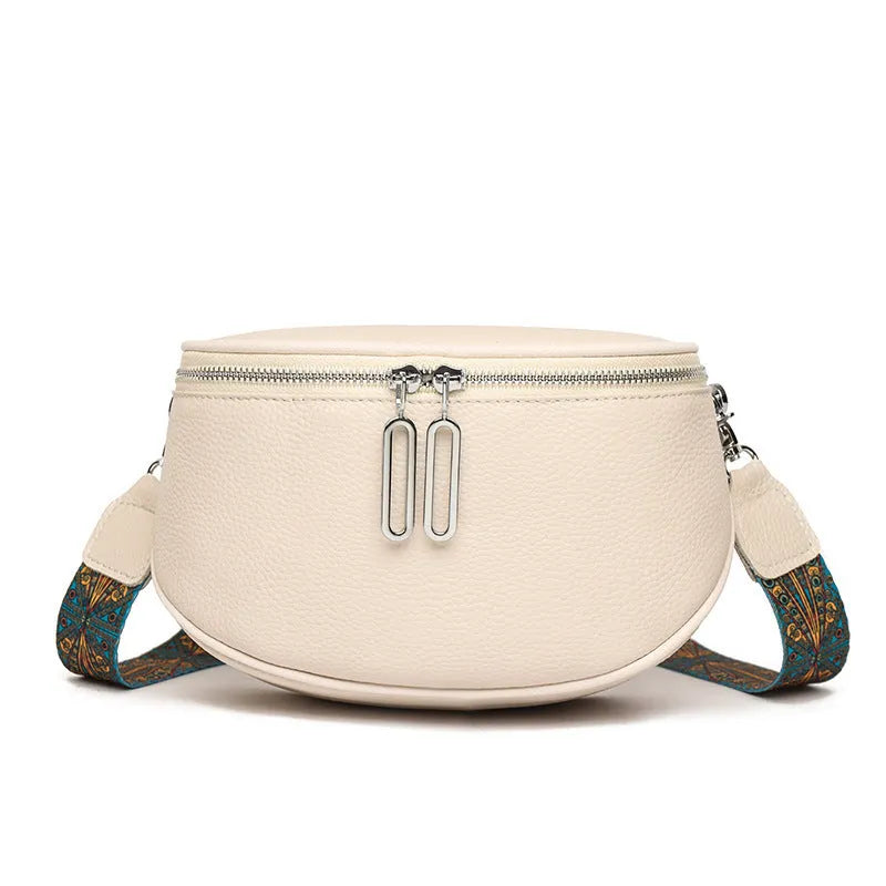 Women's soft PU leather messenger bag in saddle shape with cross-body strap, shown in green colour.