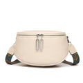 Women's soft PU leather messenger bag in saddle shape with cross-body strap, shown in green colour.
