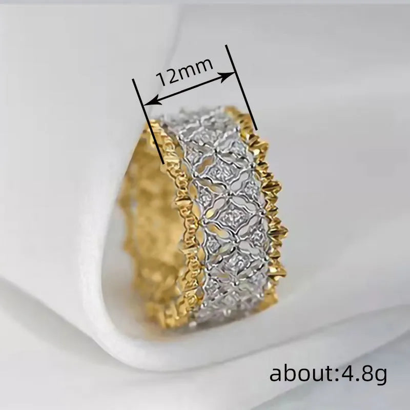 Two-tone gold copper ring with round zircon stone on white background