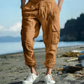Men's linen casual trousers with ankle-tied design and multiple pockets in army green colour.