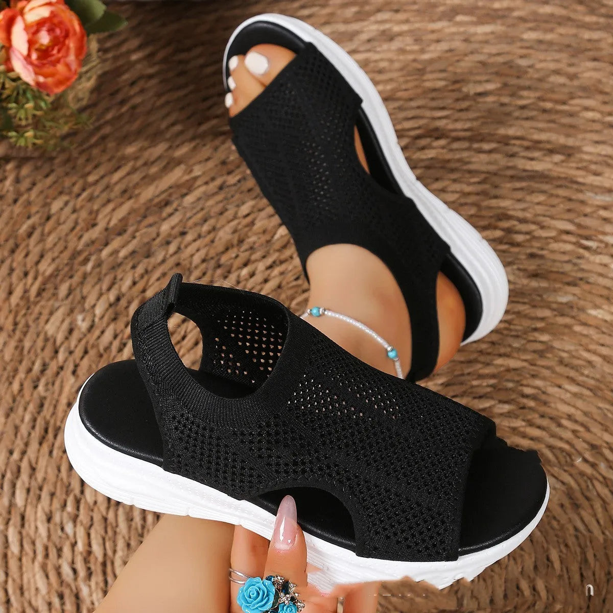 Women's black platform sports sandals with a flat toe and mesh lining on a rubber sole.