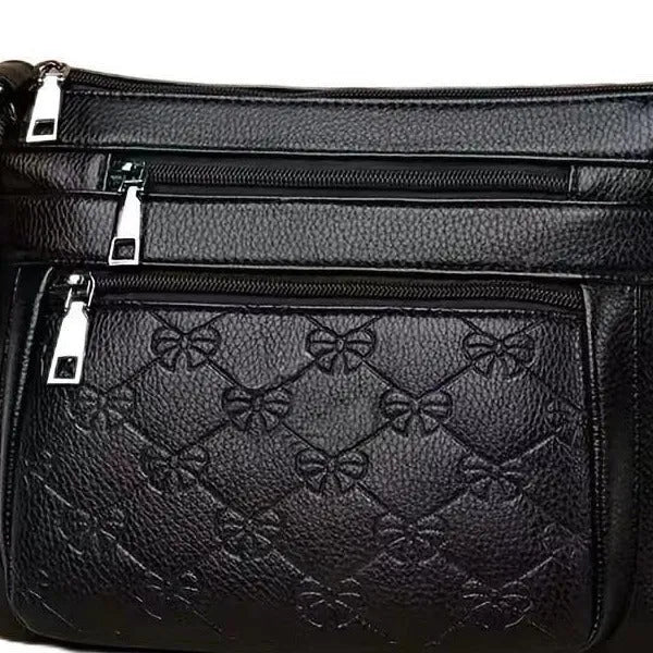 Butterfly black PU leather women's crossbody messenger bag with embossed design and horizontal square shape