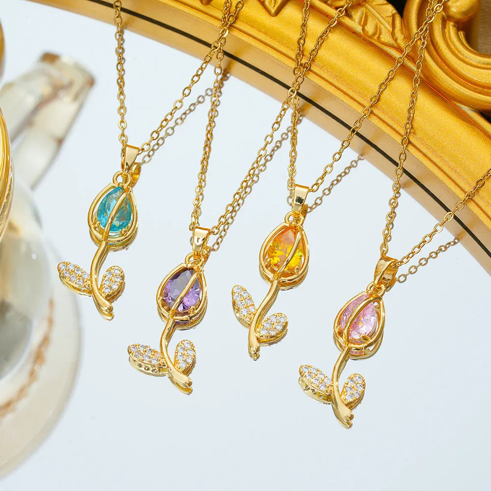 Gold-coloured tulip flower pendant necklace on a titanium steel chain for women.