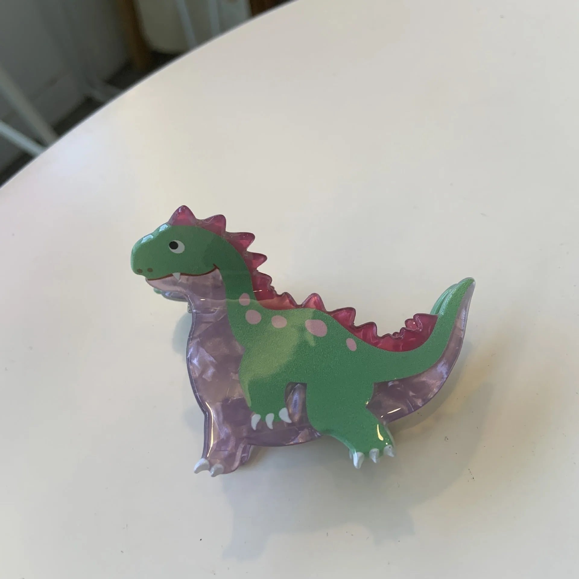 Acrylic dinosaur jaw clip hairpin in blue, brown, green, pink and purple colours with manual grip style