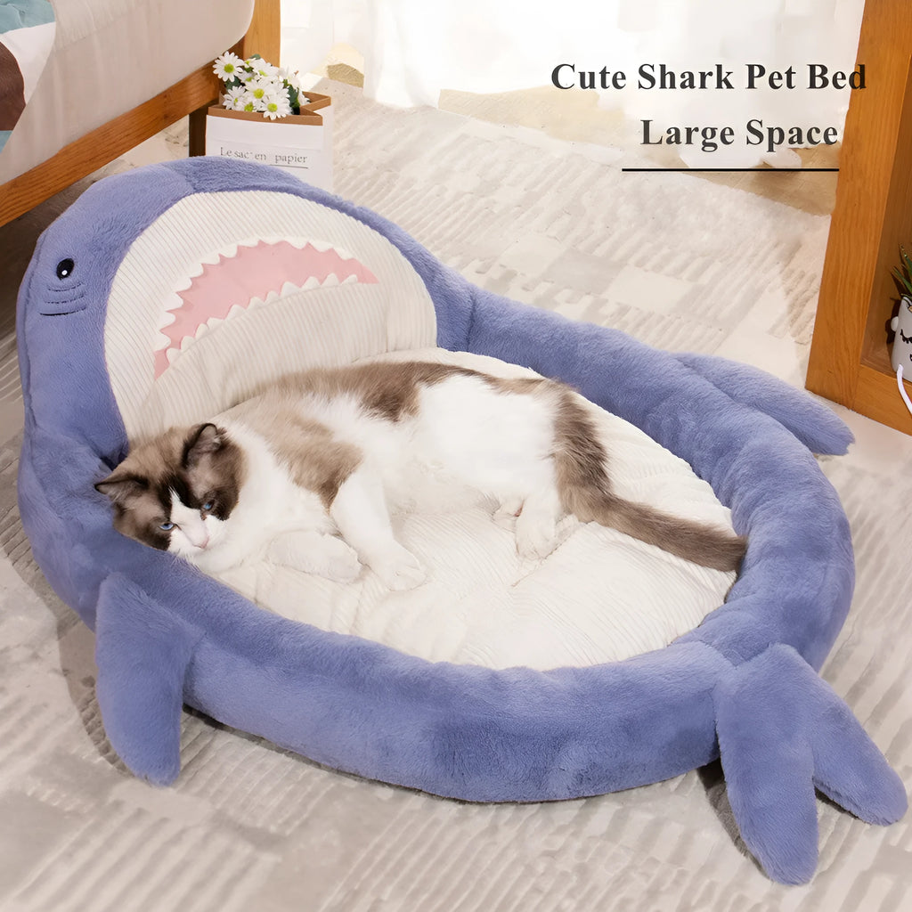 Blue shark pattern pet bed cushion for a small dog on a wooden floor