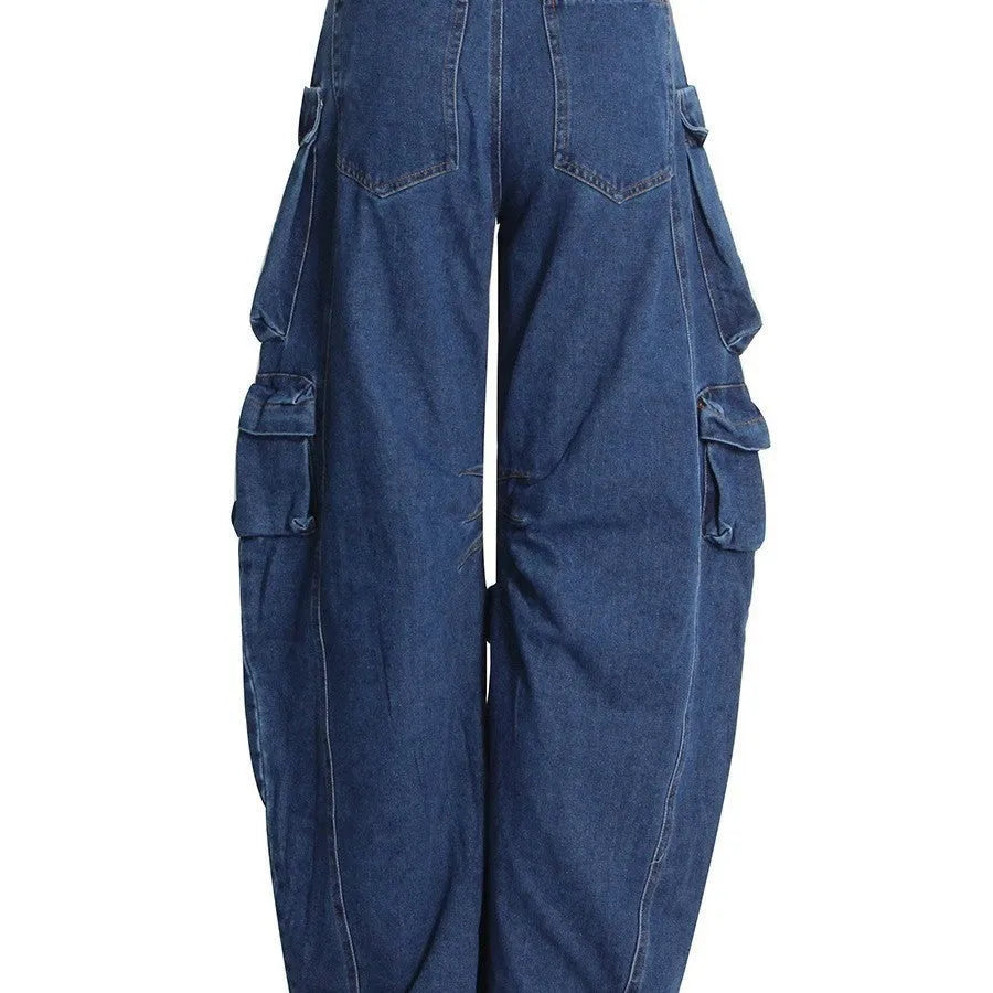 Dark blue wide-leg jeans with distressed detailing, high waist, and multiple pockets on mannequin