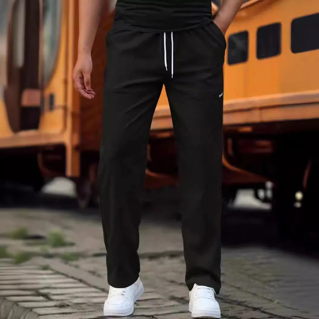 Men's casual polyester trousers for spring and autumn in light grey colour.