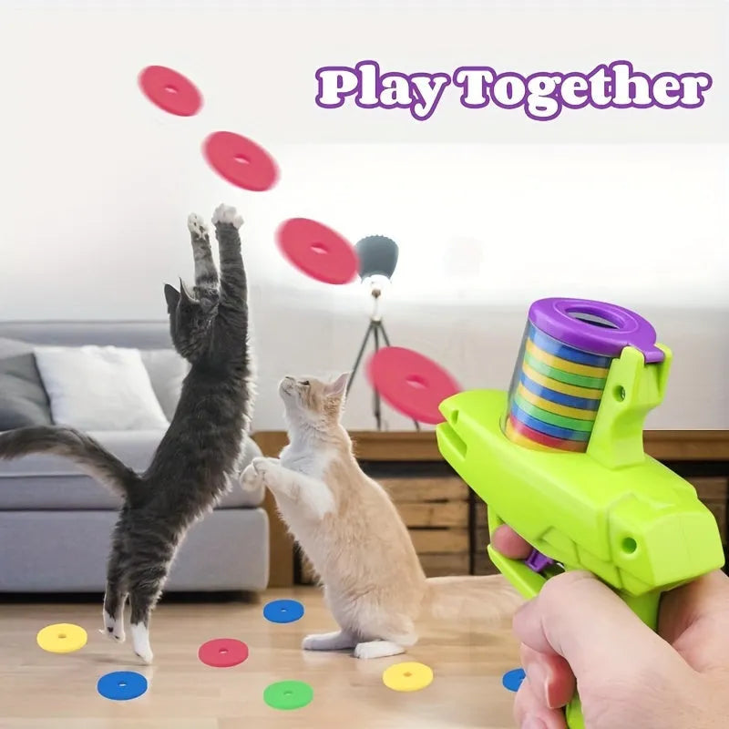 Battery-free interactive cat toy launcher with colourful foam discs on purple base