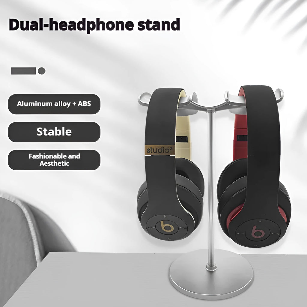 Desktop double-hanging earphone bracket in black holding two headphones on a desk