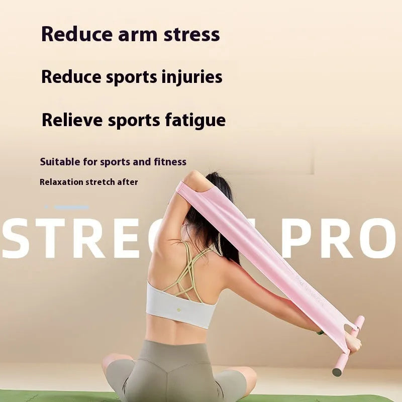 Grey and pink yoga stretching tool for shoulder and hip flexibility on a plain background.