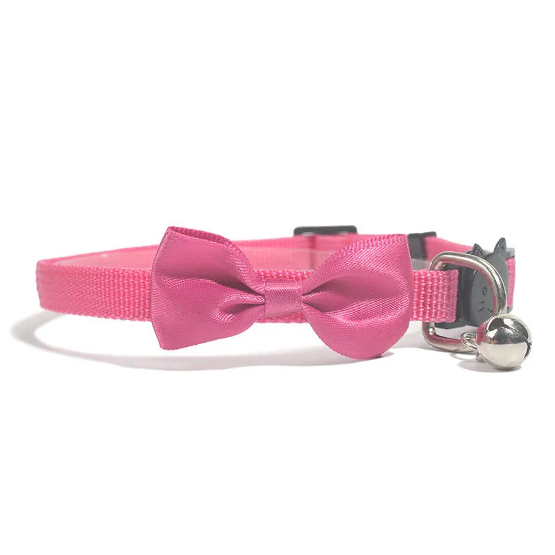Adjustable striped nylon cat collar with a bell shown in multiple colours including red, blue, green, and pink.