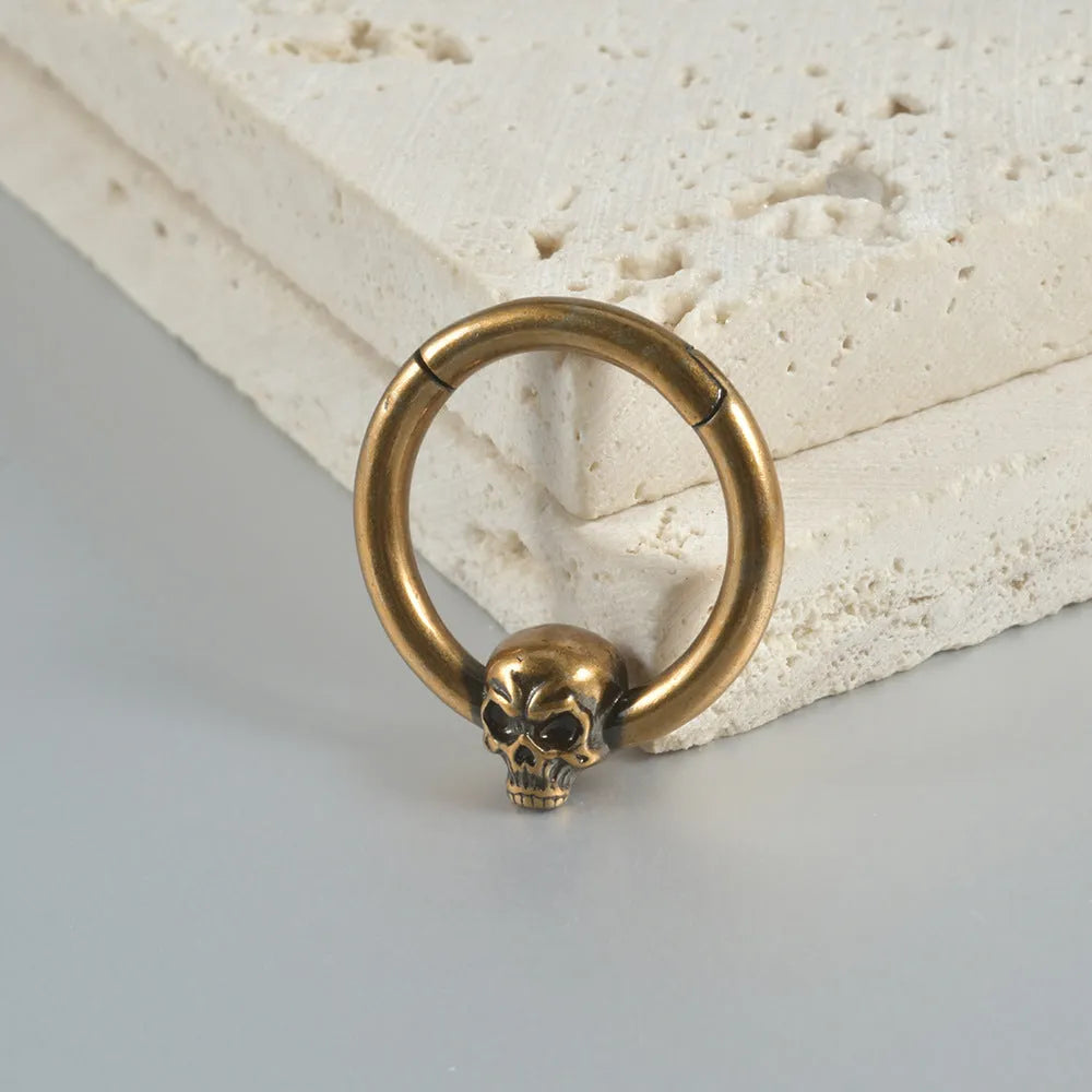 Copper punk earrings with vintage ghost head design in antique gold and silver finishes