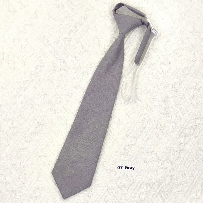 Solid navy blue men's cotton tie with arrow-type design on a white background.