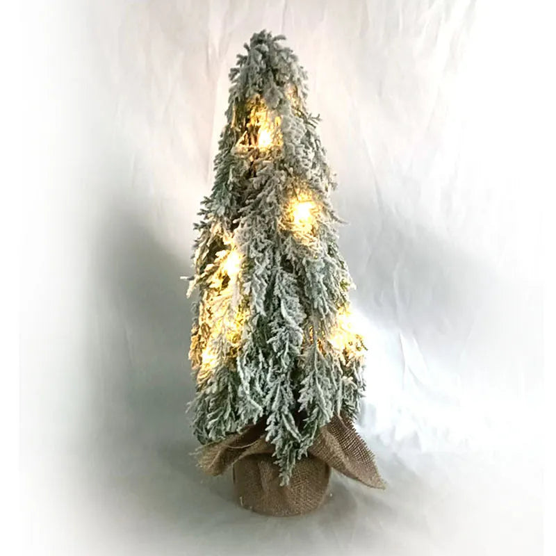 24-inch small artificial Christmas tree with snow spray decoration and built-in lights on desktop