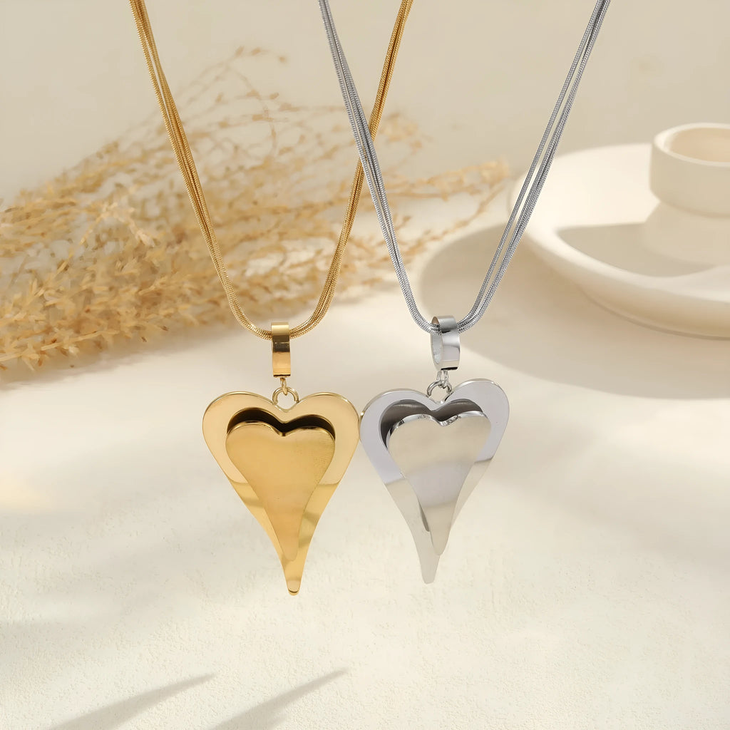 Stainless steel geometric necklace with double heart snake bones pendant in gold or steel colour options