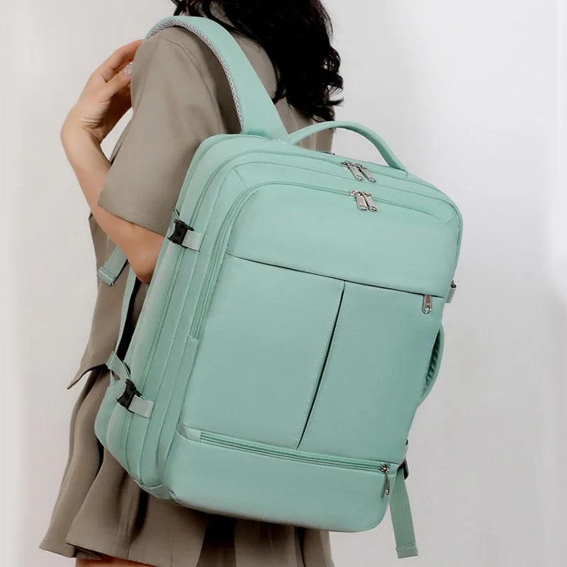 Large waterproof oxford cloth backpack with multiple pockets open to show 15.6-inch laptop compartment