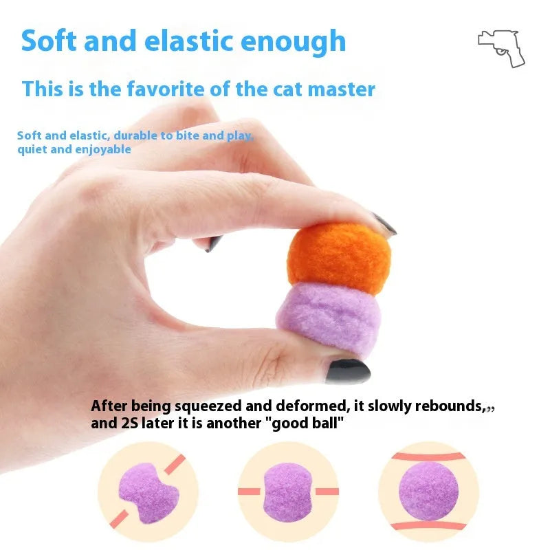 Plush cat toy launch gun with soft yarn balls for interactive indoor pet play.