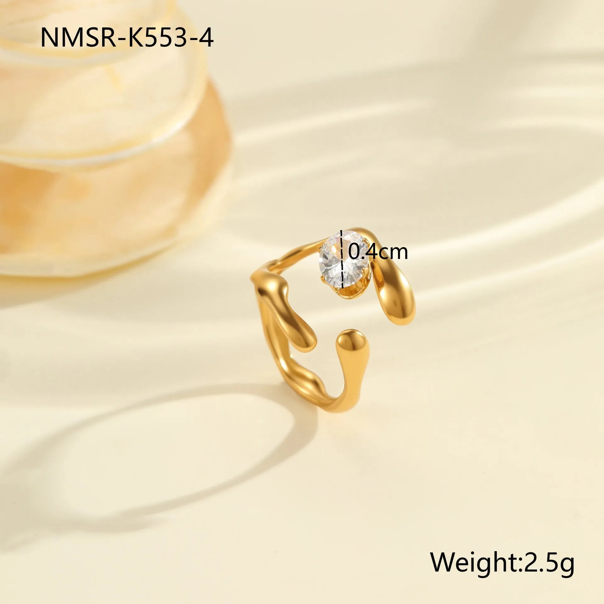 Geometric stainless steel zircon ring with open mouth design on a hand.
