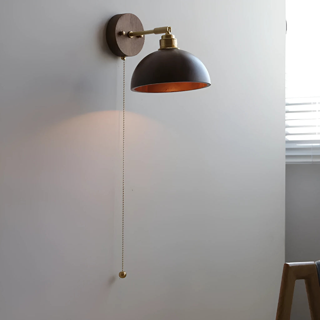 Nordic style walnut wood coloured wall-mounted bedside lamp with a fixed arm.