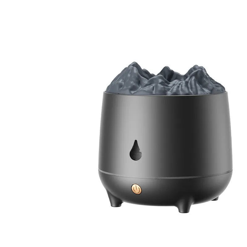 Black volcano-shaped ultrasonic humidifier with USB cable on wooden desk emitting mist
