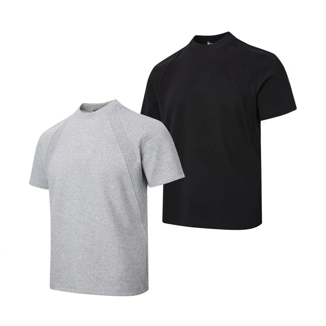 Man wearing a loose-fit grey short sleeve polyester top with air layer stitching.