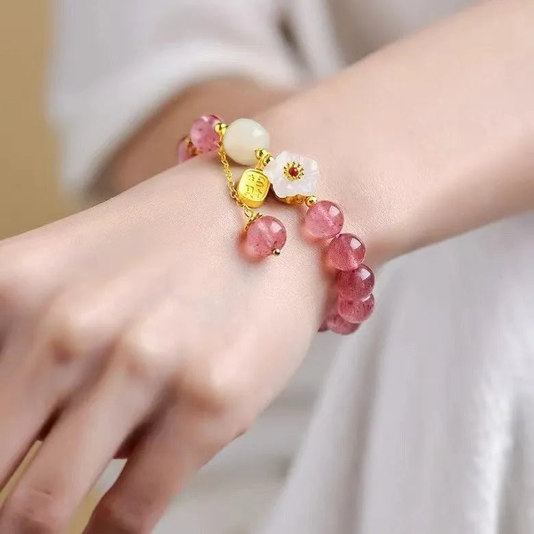 Handmade strawberry quartz crystal bracelet with hetian jade peach blossom elements in five style variations
