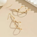 Gold spiral design alloy earrings with geometric ellipse shape