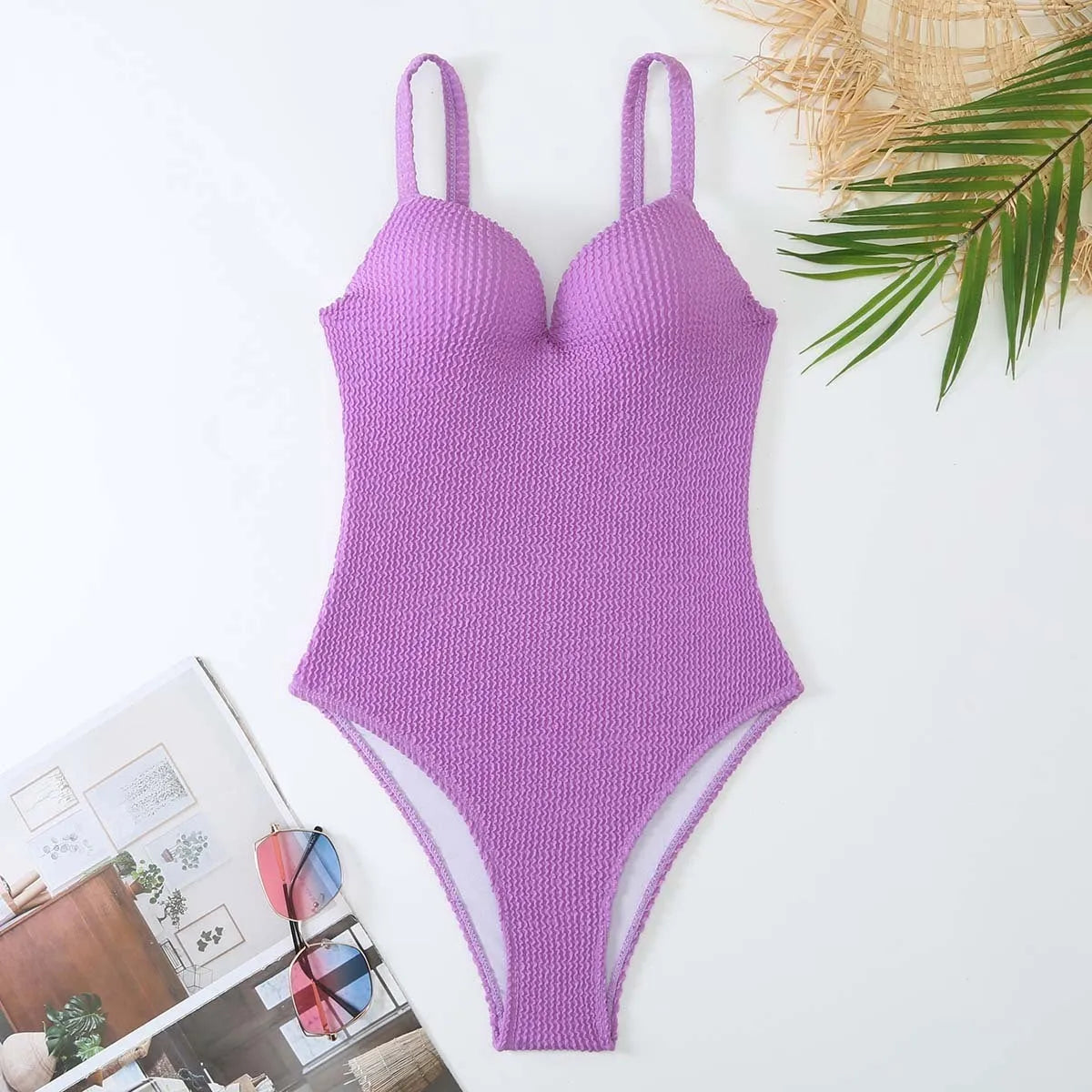 Women's sleeveless one-piece swimsuit with sunken stripe pattern in multiple colour options