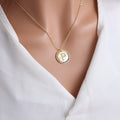 Gold round necklace with colourful crystal letter pendant on a clavicle chain