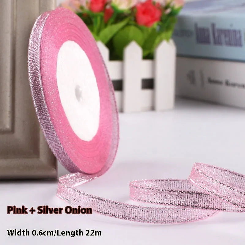 Roll of 0.6cm wide coloured polyester gift ribbon with 22 metre length.