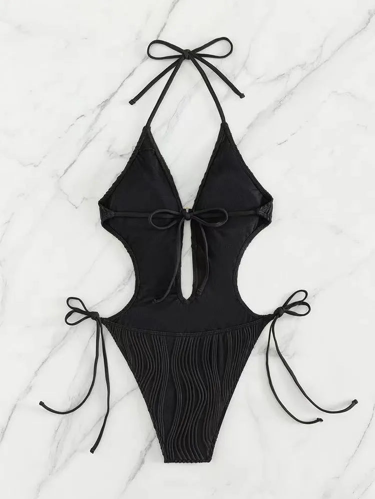 Women's black triangle bikini with front lace-up detail and matching bottoms