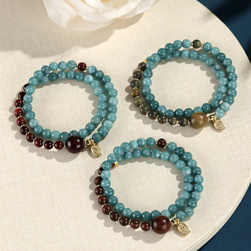 Natural stone blue gold sandalwood beaded bracelet for women with fu character and geometric design