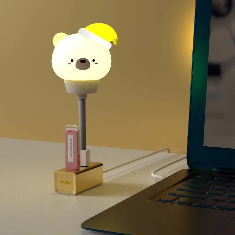 Cartoon bear or rabbit USB LED night light with remote control on a bedside table