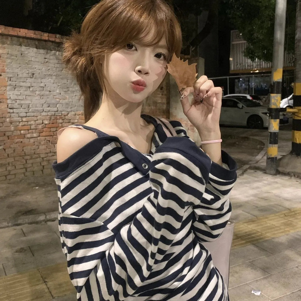Dark blue Korean-style oversized women's long-sleeved T-shirt with embroidery, stripes, and button details on a soft viscose fabric.