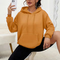 Women's loose fit grey sweatshirt with front drawstring detail and long sleeves on a hanger