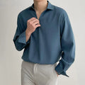 Men's loose lapel casual long sleeve shirt in solid colours on a hanger