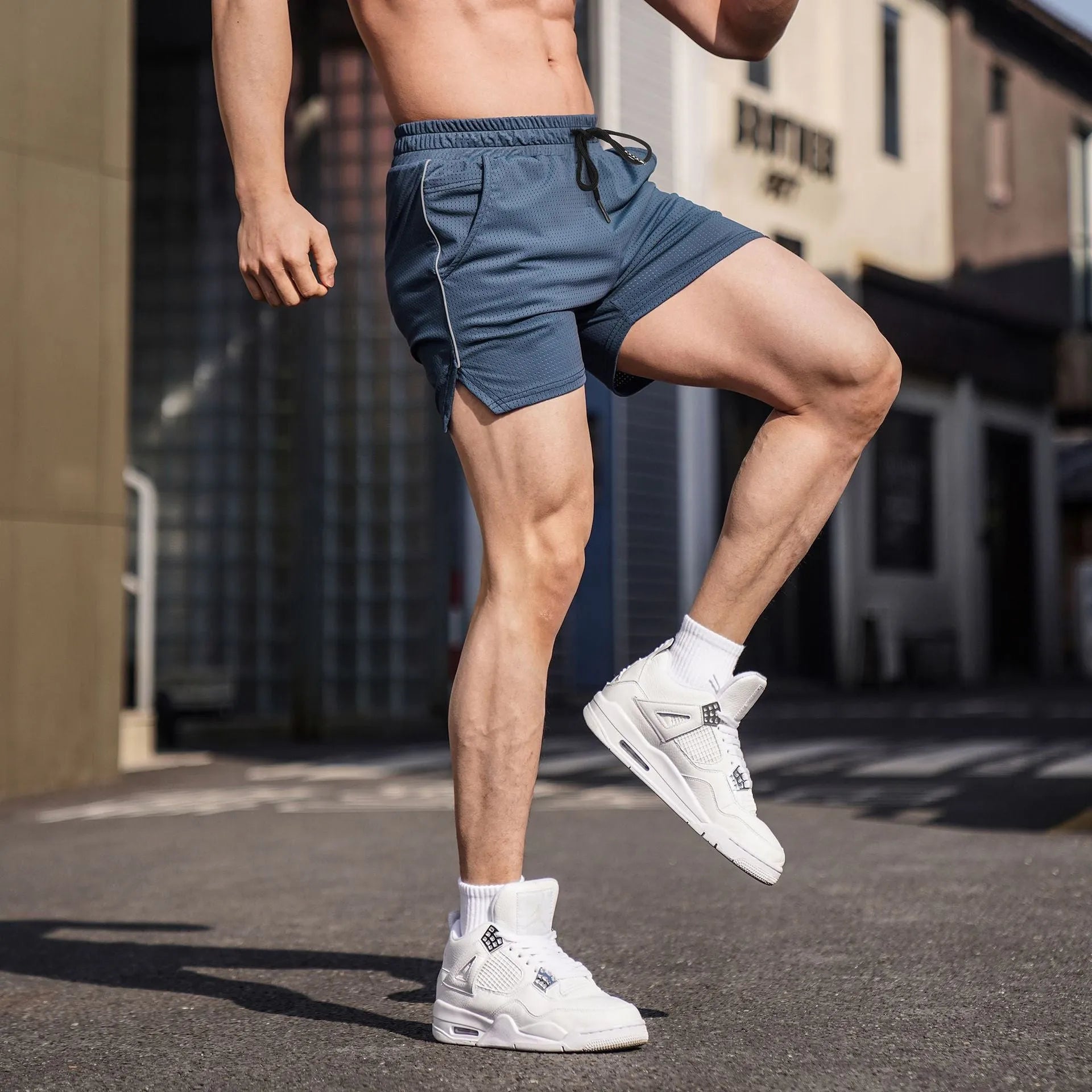 Men's straight leg sports shorts in polyester fabric available in multiple colours