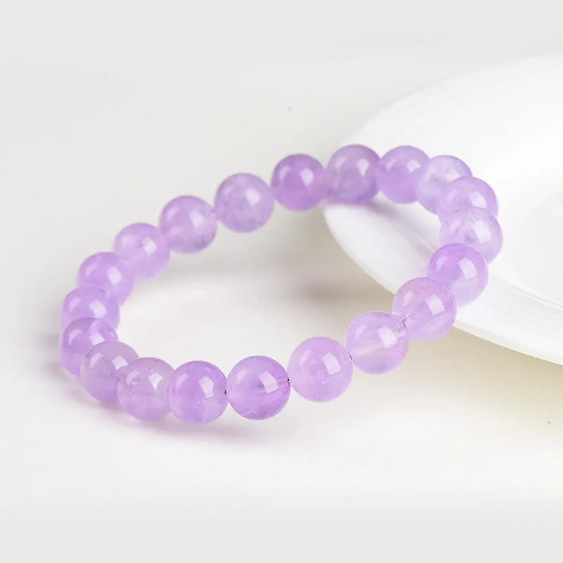 Amethyst crystal beaded bracelet with round lavender beads showing water ripple geometric pattern