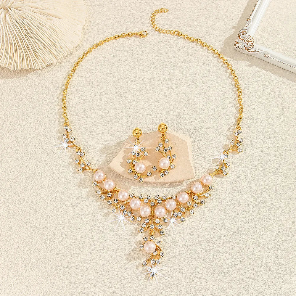Women's fashion necklace and earrings set in gold or white with alloy construction and floral pattern
