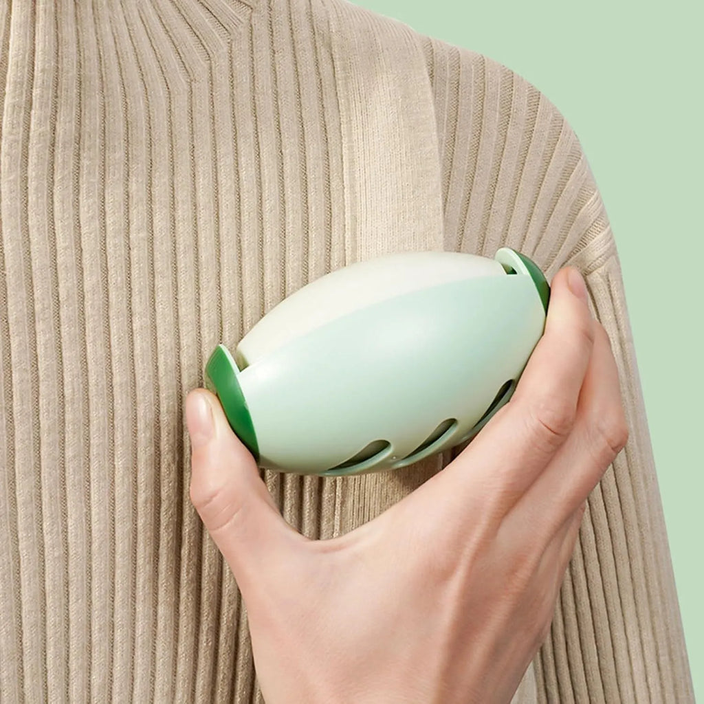 Green and white reusable gel lint roller ball for portable pet hair removal on clothing