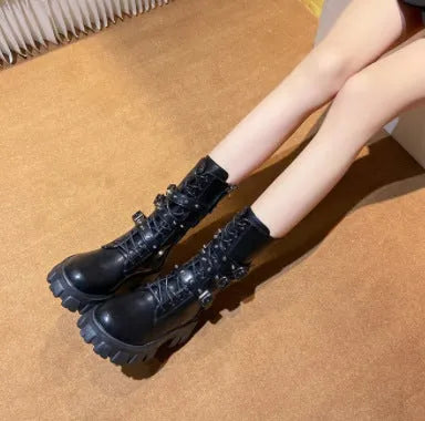 Women's black mid-calf knight boots with a metal buckle strap and side zipper.