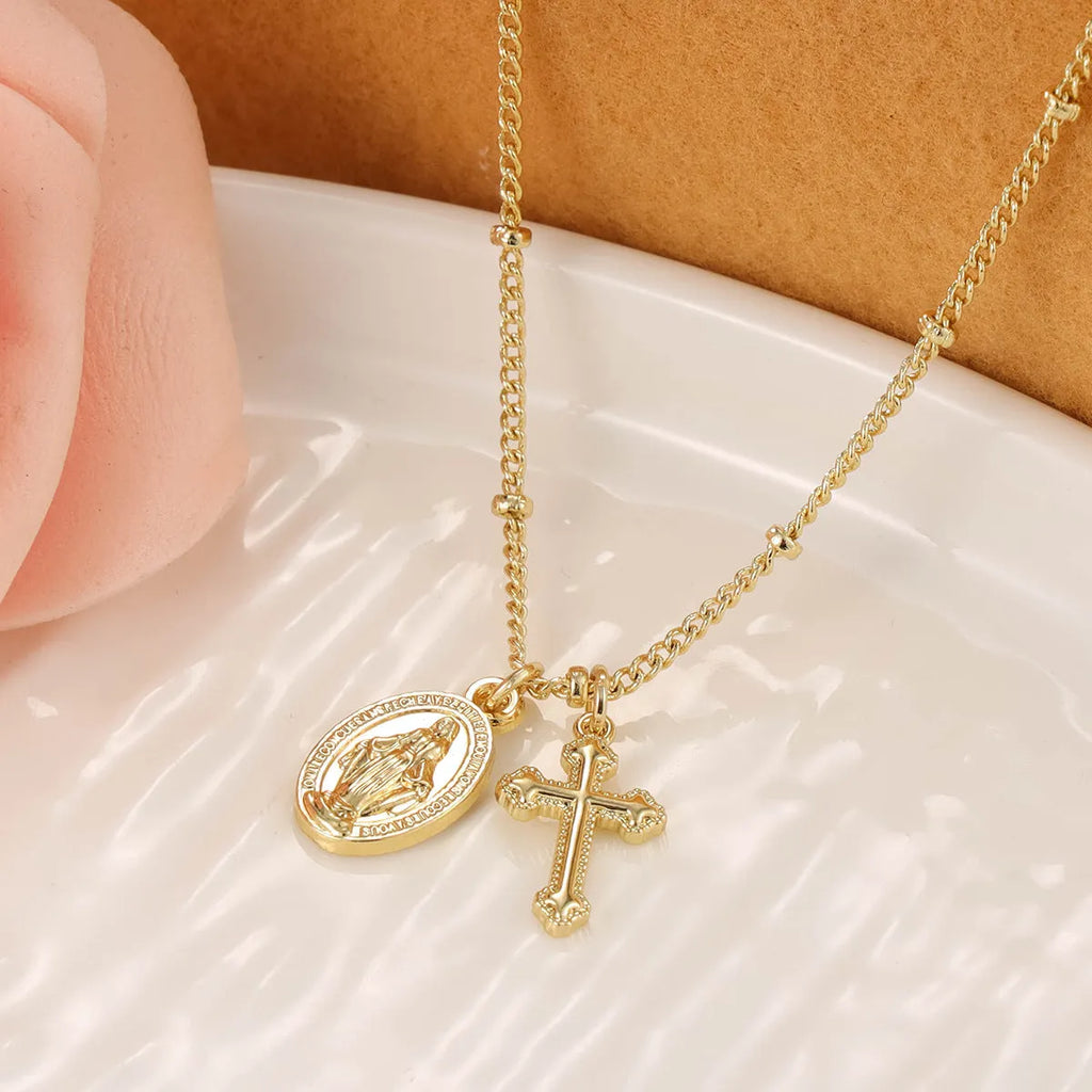 Gold Virgin Mary cross necklace with geometric pendant on 18K copper chain