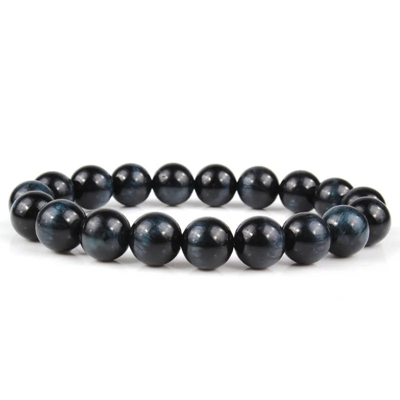 Unisex tigereye crystal bead bracelet with round geometric beads, shown in a dark blue variant.
