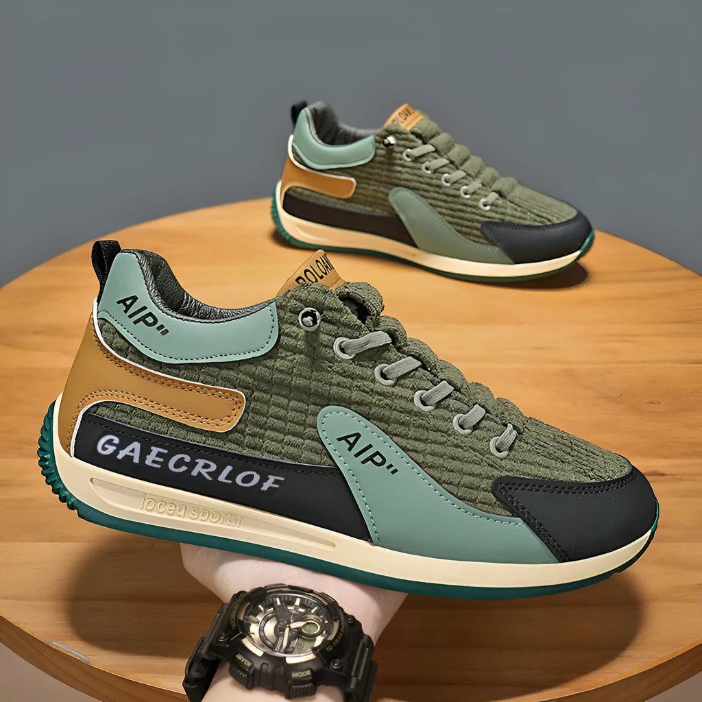 Men's green and grey low-top mesh running shoes with round toe and lace-up front.