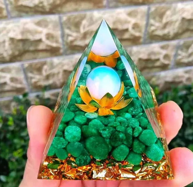 Clear epoxy resin pyramid ornament with embedded coloured crystal gravel inside, measuring 6cm.