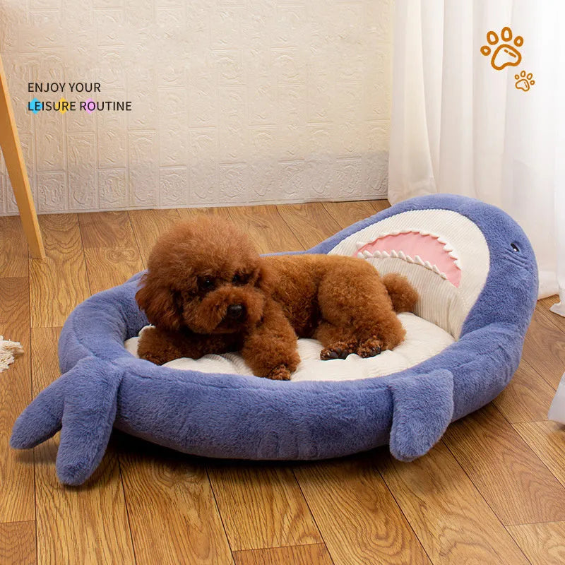 Blue shark pattern pet bed cushion for a small dog on a wooden floor